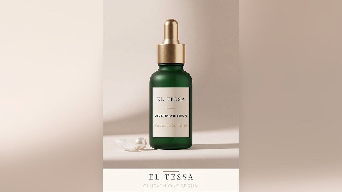 Green EL TESSA Glutathione Serum dropper bottle with a pearl on a beige surface