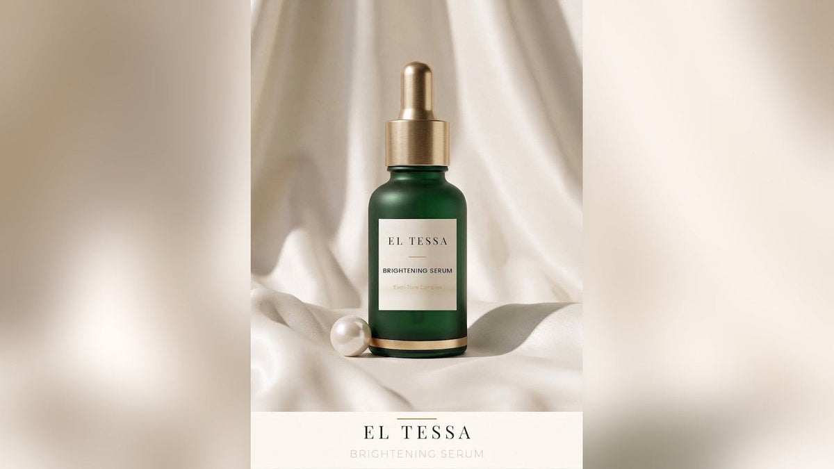 Green EL TESSA Brightening Serum dropper bottle on soft white fabric with a pearl