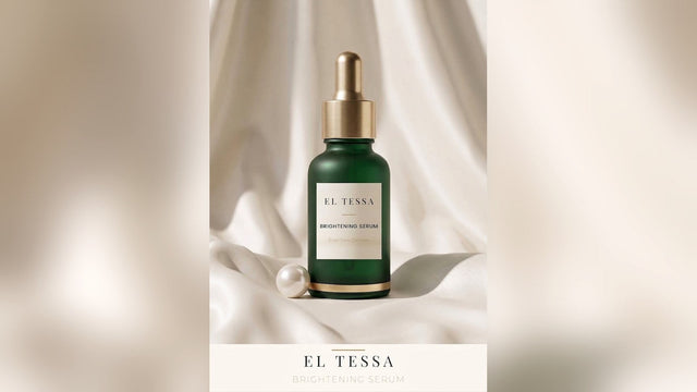 Green EL TESSA Brightening Serum dropper bottle on soft white fabric with a pearl