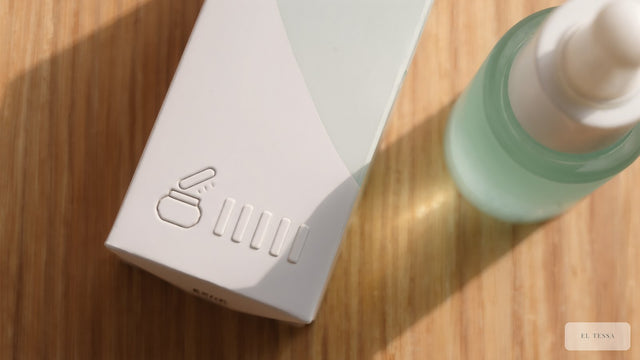 The base of a plain skincare carton with an embossed open-jar PAO symbol and batch marks beside a serum bottle